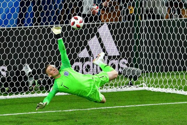  England goalkeeper Jordan Pickford saves a penalty kicked by Colombias forward Carlos Bacca during the penalty shootouts during the 2018 World Cup round of 16 football match between Colombia and England at the Spartak Stadium in Moscow on July 3, 2018. / PHOTO AFP / Mladen ANTONOV / RESTRICTED TO EDITORIAL USE - NO MOBILE PUSH ALERTS / DOWNLOADS 