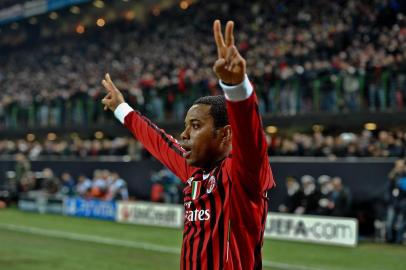 136555164AC Milan's Brazilian forward Robinho celebrates after scoring against Arsenal during the UEFA Champions League round of 16 first leg match AC Milan vs Arsenal at San Siro stadium on February 15, 2012 in Milan. AFP PHOTO / ANDREAS SOLAROEditoria: SPOLocal: MilanIndexador: ANDREAS SOLAROSecao: SoccerFonte: AFPFotógrafo: STR