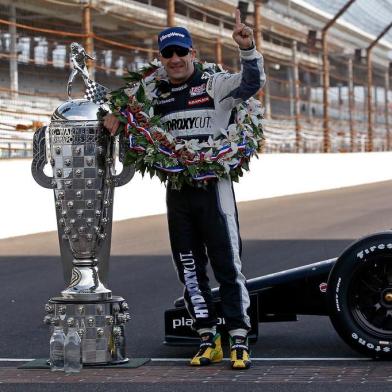 INDIANAPOLIS, IN - MAY 27: 2013 Indianapolis 500 Champion Tony Kanaan of Brazil, driver of the Hydroxycut KV Racing Technology-SH Racing Chevrolet, poses with the Borg Warner Trophy on the yard of bricks during the Indianapolis 500 Mile Race Trophy Presentation and Champions Portrait Session at Indianapolis Motor Speedway on May 27, 2013 in Indianapolis, Indiana. Kanaan earned his first Indy 500 victory by winning the 97th running of the race.   Chris Graythen/Getty Images/AFP