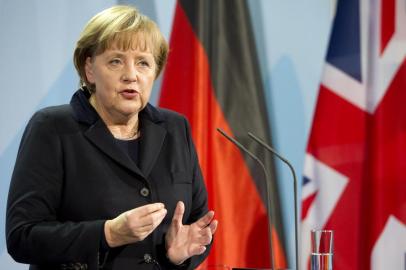 German Chancellor Angela Merkel speaks during a joint press conference with the British Prime Minister on November 18, 2011 at the Chancellery in Berlin. Merkel met British Prime Minister David Cameron, whose country is a non-eurozone member, amid sharp differences over handing more central power to Brussels as the eurozone tackles its debt crisis.     AFP PHOTO / ODD ANDERSEN