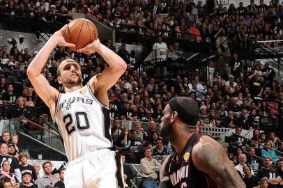 SAN ANTONIO, TX - JUNE 16: Manu Ginobili #20 of the San Antonio Spurs attempts a shot against LeBron James #6 of the Miami Heat during Game Five of the 2013 NBA Finals on June 16, 2013 at the AT&T Center in San Antonio, Texas. NOTE TO USER: User expressly acknowledges and agrees that, by downloading and or using this photograph, User is consenting to the terms and conditions of the Getty Images License Agreement. Mandatory Copyright Notice: Copyright 2013 NBAE   Andrew D. Bernstein/NBAE via Getty Images/AFP