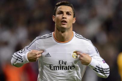 ALTERNATIVE CROPReal Madrid's Portuguese forward Cristiano Ronaldo celebrates after scoring during the UEFA Champions League Group B football match Real Madrid CF vs Juventus at the Santiago Bernabeu stadium in Madrid on October 23, 2013.   AFP PHOTO / DANI POZO