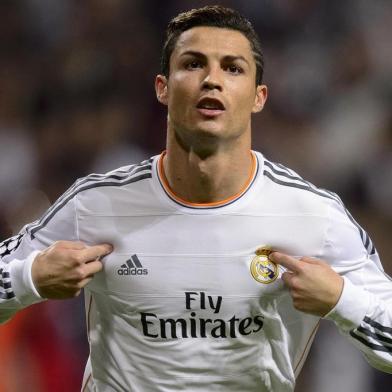 ALTERNATIVE CROPReal Madrid's Portuguese forward Cristiano Ronaldo celebrates after scoring during the UEFA Champions League Group B football match Real Madrid CF vs Juventus at the Santiago Bernabeu stadium in Madrid on October 23, 2013.   AFP PHOTO / DANI POZO