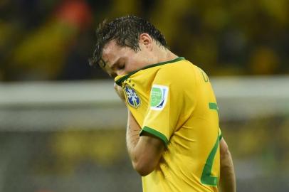 491932073Brazil's forward Bernard reacts during the semi-final football match between Brazil and Germany at The Mineirao Stadium in Belo Horizonte during the 2014 FIFA World Cup on July 8, 2014.     AFP PHOTO / FABRICE COFFRINIEditoria: SPOLocal: Belo HorizonteIndexador: FABRICE COFFRINISecao: sports eventFonte: AFPFotógrafo: STF