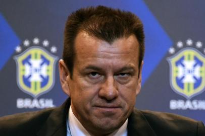  Brazil's 1994 World-Cup winning skipper Carlos Verri, better known as "Dunga", is presented as the new coach of the Brazilian national football team, at the headquarters of the Brazilian Football Confederation (CBF) in Rio de Janeiro, on July 22, 2014. The CBF on Tuesday appointed Dunga as coach, replacing Luiz Felipe Scolari, whose contract was not renewed after the hosts' World Cup semi-final thrashing by Germany. Dunga takes the reins for a second time having led the Selecao at the 2010 tournament.  AFP PHOTO/VANDERLEI ALMEIDAEditoria: SPOLocal: Rio de JaneiroIndexador: VANDERLEI ALMEIDASecao: SoccerFonte: AFPFotógrafo: STF