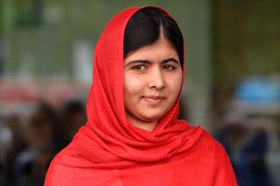 (FILES) Photo taken on September 3, 2013 shows Malala Yousafzai, the 16-year-old Pakistani advocate for girls education who was shot in the head by the Taliban in 2012, opening the Library of Birmingham in Birmingham, central England . Malala Yousafzai, Pakistans teenage activist, on October 10, 2013 was awarded the European Parliaments prestigious Sakharov human rights prize. AFP PHOTO / PAUL ELLIS