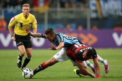 PORTO ALEGRE, RS, BRASIL. Partida entre Grêmio e Vitória, válida pela 32ª rodada do Brasileirão, na Arena do Grêmio, na Capital.

Foto: Diego Vara/Agência RBS