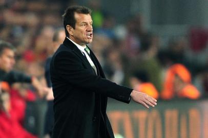 Brazil`s head coach Carlos Caetano Bledorn Verri Dunga gestures during the friendly football match Turkey  vs Brazil on November 12, 2014 at Fenerbahce Sukru Saracoglu stadium in Istanbul. AFP PHOTO/OZAN KOSE