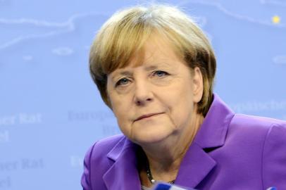 Germany's Federal Chancellor Angela Merkel holds a press conference at the end of the second and last day of an European Union (EU) Council meeting on October 25, 2013 at the EU Headquarters in Brussels. Europe's leaders sought how to deal with the drama of Mediterranean boat-people today, weeks after the deaths by drowning of 400 refugees fleeing conflict shocked many across the continent.   AFP PHOTO / THIERRY CHARLIER