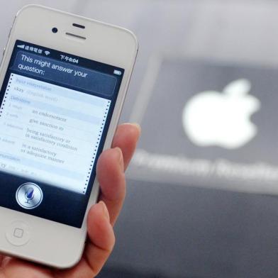 A woman displays "Siri", voice-activated assistant technology, on an Apple iPhone 4S in Taipei on July  30, 2012. Taiwan's National Cheng Kung University has filed a suit against US tech giant Apple, claiming the company's Siri intelligent assistant has infringed on two of its patents. 