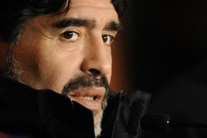 Argentina's coach Diego Maradona attends a press conference at Green Point stadium in Cape Town on July 2, 2010, on the eve of their 2010 World Cup quarter-final football match against Germany.  AFP PHOTO / JAVIER SORIANO.