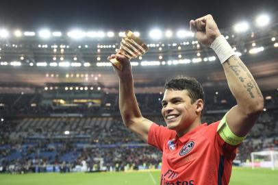 Paris Saint-Germain's Brazilian defender Thiago Silva celebrates at the end of the French League Cup final football match Bastia (SCB) vs Paris Saint-Germain, on April 11, 2015 at the Stade de France in Saint-Denis, outside Paris.