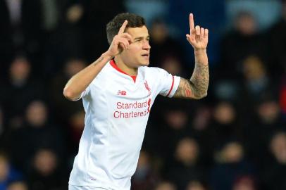  Liverpool's Brazilian midfielder Philippe Coutinho celebrates after scoring their first goal during the English FA Cup fourth round replay football match between West Ham United and Liverpool at The Boleyn Ground in Upton Park, east London, on February 9, 2016.Editoria: SPOLocal: LondonIndexador: GLYN KIRKSecao: soccerFonte: AFP