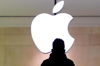 A man walks up the stairs at the Apple Store in Grand Central Station February 25, 2016. Apple has been in a legal fight with the government in the San Bernardino case, where the FBI wants the company to help hacking the iPhone of Syed Farook, a US citizen, who gunned down 14 people with his Pakistani wife Tashfeen Malik in the California city in December.Timothy A. CLARY / AFP