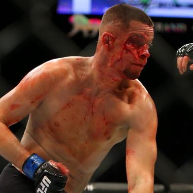 LAS VEGAS, NV - MARCH 5: Nate Diaz punches Conor McGregor during UFC 196 at the MGM Grand Garden Arena on March 5, 2016 in Las Vegas, Nevada.   Rey Del Rio/Getty Images/AFP