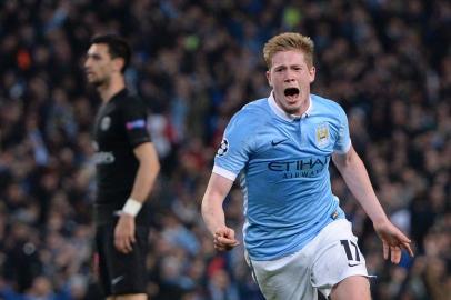 Manchester Citys Belgian midfielder Kevin De Bruyne celebrates after scoring during the UEFA Champions league quarter-final second leg football match between Manchester City and Paris Saint-Germain at the Etihad stadium in Manchester on April 12, 2016. OLI SCARFF / AFP