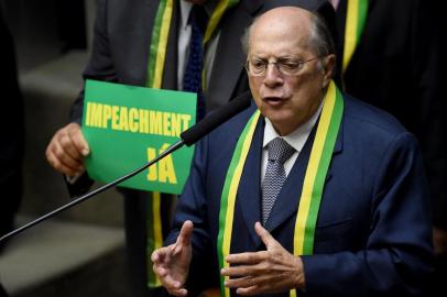 Jurist Miguel Reale Jr, author of the Impeachment request speaks at the Lower House of the Congress in Brasilia on April 15, 2016.  Brazils lower house of Congress opened debate Friday on impeachment of President Dilma Rousseff ahead of a vote this weekend that could seal her fate. / AFP PHOTO / EVARISTO SA