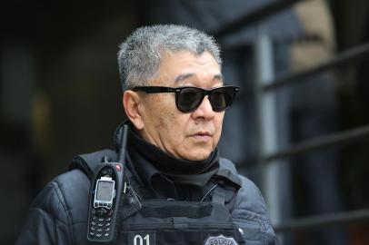 Empresários fazem exame de corpo de delito no IML de CuritibaPR - LAVA JATO/OPERAÇÃO VÍCIO - GERAL - O agente da Polícia Federal, Newton Hidenori Ishii, durante a 30ª fase da Operação Lava   Jato, no Instituto Médico Legal, em Curitiba, nesta quarta-feira (25).   25/05/2016 - Foto: GIULIANO GOMES/ESTADÃO CONTEÚDOEditoria: GERALLocal: CURITIBAIndexador: GIULIANO GOMESFotógrafo: ESTADÃO CONTEÚDO