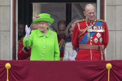 (L-R) Britains Camilla, Duchess of Cornwall, Britains Prince Charles, Prince of Wales, Britains Catherine, Duchess of Cambridge holding her daughter Princess Charlotte, Prince George and Britains Prince William, Duke of Cambridge stand on the balcony of Buckingham Palace to watch a fly-past of aircrafts by the Royal Air Force, in London on June 11, 2016. Trooping The Colour and the fly-past are part of a weekend of events to celebrate the Queens 90th birthday.