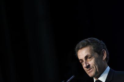 (FILES) This file photo taken on June 26, 2016 shows Former French president and head of the right-wing opposition party Les Republicains (The Republicans) Nicolas Sarkozy reacting as he delivers a speech during a meeting for the Fete de la federation des Republicains - Celebration of the federation of the Republicains  in Chartres-de-Bretagne, near Rennes, western France.Former French leader Nicolas Sarkozy on August 22, 2016 announced he will seek his partys nomination to stand in next years presidential election. I have decided to be a candidate in the 2017 presidential election, Sarkozy, who was president between 2007 and 2012, wrote in a foreword to a new book to be released on August 24, 2016 and seen by AFP. Sarkozy also posted a link to the extract on his Twitter account. / AFP PHOTO / JEAN-SEBASTIEN EVRARD