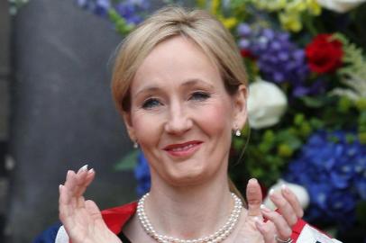 A picture taken on September 26, 2011 shows Harry Potter author J.K. Rowling applauding after receiving a Benefactors Award at an open air ceremony at the University of Edinburgh. J.K. Rowling, the British author of the best-selling Harry Potter books, was forced to reveal on July 14, 2013 that she had published a critically acclaimed crime novel under a pseudonym. The publisher that bought the German rights to a novel for a song before learning that the author was Harry Potter writer J.K. Rowling said on July 21 it was eyeing a windfall.   