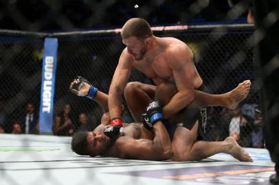 CLEVELAND, OH - SEPTEMBER 10: Stipe Miocic punches Alistair Overeem during the UFC 203 event at Quicken Loans Arena on September 10, 2016 in Cleveland, Ohio.   Rey Del Rio/Getty Images/AFP