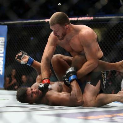 CLEVELAND, OH - SEPTEMBER 10: Stipe Miocic punches Alistair Overeem during the UFC 203 event at Quicken Loans Arena on September 10, 2016 in Cleveland, Ohio.   Rey Del Rio/Getty Images/AFP