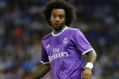 Real Madrid's Portuguese defender Marcelo controls the ball during the Spanish league football match RCD Espanyol vs Real Madrid CF at the Cornella-El Prat stadium in Cornella de Llobregat on September 18, 2016. PAU BARRENA / AFP