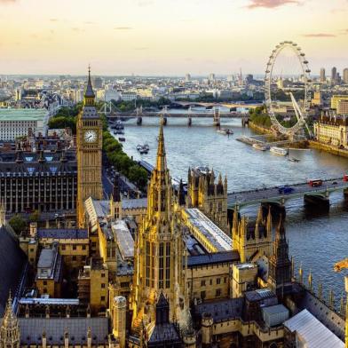 The view from Victoria Tower of the Houses of Parliament, the River Thames, Westminster and Westminster Bridge, to the Millennium Wheel and other landmarks in the evening as the light fades. This image must be reproduced with the credit 'VistBritain/Andrew Pickett'