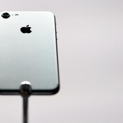  

The iPhone 7 is seen on display during an Apple media event at Bill Graham Civic Auditorium in San Francisco, California on September 7, 2016. Apple on Wednesday unveiled two upgraded versions of its iPhone and a new waterproof smartwatch, seeking to reignite growth for the iconic technology maker. The iPhone 7 and larger iPhone 7 Plus, with new camera technology, 50-meter water resistance and other features, were the highlight of an Apple media event in San Francisco.