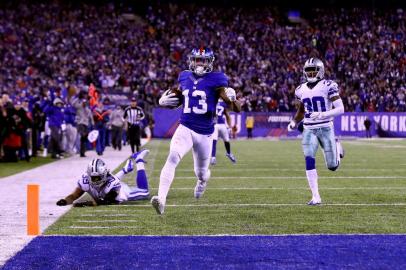 Dallas Cowboys v New York GiantsEAST RUTHERFORD, NJ - DECEMBER 11: Odell Beckham Jr. #13 of the New York Giants scores a 61 yard touchdown against the Dallas Cowboys during the third quarter of the game at MetLife Stadium on December 11, 2016 in East Rutherford, New Jersey.   Al Bello/Getty Images/AFPEditoria: SPOLocal: East RutherfordIndexador: AL BELLOSecao: American FootballFonte: GETTY IMAGES NORTH AMERICAFotógrafo: STF