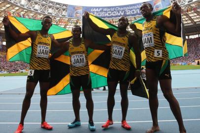 Jamaica Usain Bolt (R),Jamaica Nickel Ashmeade, Jamaica Oshane Bailey and Jamaica Nesta Carter pose after winning the men 4x100 metres relay final at the 2013 IAAF World Championships at the Luzhniki stadium in Moscow on August 18, 2013