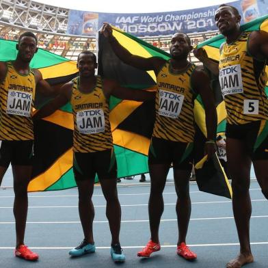 Jamaica Usain Bolt (R),Jamaica Nickel Ashmeade, Jamaica Oshane Bailey and Jamaica Nesta Carter pose after winning the men 4x100 metres relay final at the 2013 IAAF World Championships at the Luzhniki stadium in Moscow on August 18, 2013