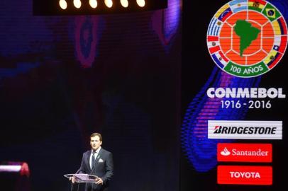 CONMEBOLs President, Alejandro Dominguez speaks during the Libertadores Cup draw in Luque, Paraguay, on December 21, 2016.  / AFP PHOTO / NORBERTO DUARTE