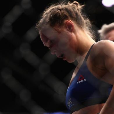 LAS VEGAS, NV - DECEMBER 30: Ronda Rousey reacts to her loss to Amanda Nunes in their UFC womens bantamweight championship bout during the UFC 207 event on December 30, 2016 in Las Vegas, Nevada.   Christian Petersen/Getty Images/AFP