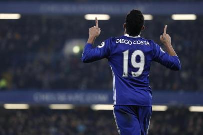 Chelsea's Brazilian-born Spanish striker Diego Costa celebrates after scoring the opening goal of the English Premier League football match between Chelsea and Hull City at Stamford Bridge in London on January 22, 2017. 
Adrian DENNIS / AFP