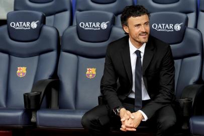 Barcelona new coach Luis Enrique Martinez poses during his presentation at the Camp Nou stadium in Barcelona on May 21, 2014