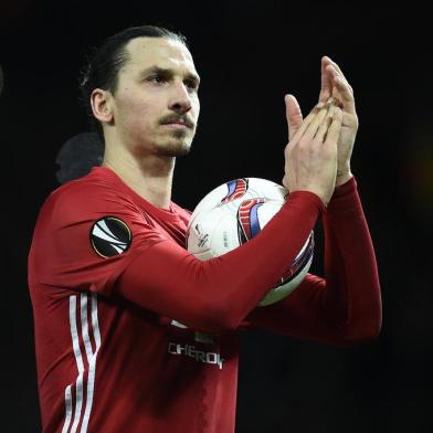 Manchester Uniteds Swedish striker Zlatan Ibrahimovic applauds the fans following the UEFA Europa League Round of 32 first-leg football match between Manchester United and Saint-Etienne at Old Trafford stadium in Manchester, north-west England, on February 16, 2017. Manchester United won the match 3-0.Oli SCARFF / AFP