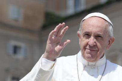 Pope Francis greets the crowd during the Easter Sunday mass on April 16, 2017 at St Peter's square in Vatican. Christians around the world are marking the Holy Week, commemorating the crucifixion of Jesus Christ, leading up to his resurrection on Easter.  