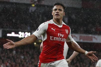 Arsenals Chilean striker Alexis Sanchez celebrates scoring the second goal during the English Premier League football match between Arsenal and Sunderland at the Emirates Stadium in London on May 16, 2017.  / AFP PHOTO / Adrian DENNIS / RESTRICTED TO EDITORIAL USE. No use with unauthorized audio, video, data, fixture lists, club/league logos or live services. Online in-match use limited to 75 images, no video emulation. No use in betting, games or single club/league/player publications.  / 