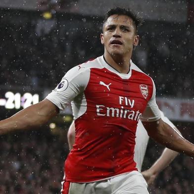 Arsenals Chilean striker Alexis Sanchez celebrates scoring the second goal during the English Premier League football match between Arsenal and Sunderland at the Emirates Stadium in London on May 16, 2017.  / AFP PHOTO / Adrian DENNIS / RESTRICTED TO EDITORIAL USE. No use with unauthorized audio, video, data, fixture lists, club/league logos or live services. Online in-match use limited to 75 images, no video emulation. No use in betting, games or single club/league/player publications.  / 