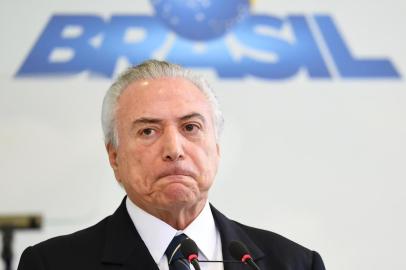  

Brazilian president Michel Temer takes part in the "A Year of Achievements" meeting in celebration of the first year of his presidential term, at the Palacio do Planalto in Brasilia, Brazil, on May 12, 2017. 
President Michel Temer celebrated one year at Brazil's helm on Friday with some questioning how much has changed in Latin America's biggest country since the traumatic impeachment of Dilma Rousseff. / AFP PHOTO / EVARISTO SA

Editoria: POL
Local: Brasília
Indexador: EVARISTO SA
Secao: politics (general)
Fonte: AFP
Fotógrafo: STF