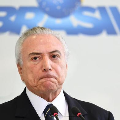  

Brazilian president Michel Temer takes part in the "A Year of Achievements" meeting in celebration of the first year of his presidential term, at the Palacio do Planalto in Brasilia, Brazil, on May 12, 2017. 
President Michel Temer celebrated one year at Brazil's helm on Friday with some questioning how much has changed in Latin America's biggest country since the traumatic impeachment of Dilma Rousseff. / AFP PHOTO / EVARISTO SA

Editoria: POL
Local: Brasília
Indexador: EVARISTO SA
Secao: politics (general)
Fonte: AFP
Fotógrafo: STF