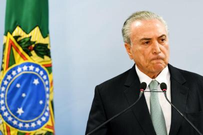 Brazil's President Michel Temer speaks during a press conference following allegations that he gave his blessing to payment of hush money to a politician convicted of corruption, on May 18, 2017 in Brasilia.
Temer faced growing pressure to resign Thursday after the Supreme Court gave its green light to the investigation over allegations that he authorized paying hush money to already jailed Eduardo Cunha, the disgraced former speaker of the lower house of Congress.  / AFP PHOTO / EVARISTO SA