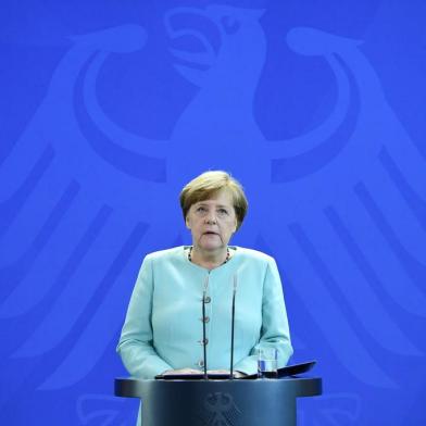 German Chancellor Angela Merkel gives a statement where she pledged more decisive action than ever on climate on June 2, 2017 at the Chancellery in Berlin, in reaction of the US Presidents decision to quit the Paris climate agreement.  
US President Donald Trump announced on June 1, 2017 that the United States is withdrawing from the Paris climate accord, prompting a furious global backlash and throwing efforts to slow global warming into doubt / AFP PHOTO / Tobias SCHWARZ