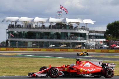 Ferrari's German driver Sebastian Vettel drives during the first practice session at the Silverstone motor racing circuit in Silverstone, central England on July 14, 2017 ahead of the British Formula One Grand Prix. / AFP PHOTO / BEN STANSALL