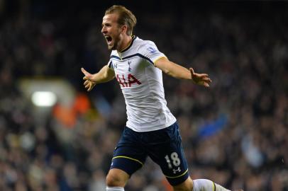 Tottenham Hotspur's English striker Harry Kane celebrates scoring their first goal during the English Premier League football match between Tottenham Hotspur and Chelsea at White Hart Lane in London on January 1, 2015. AFP PHOTO / GLYN KIRK== RESTRICTED TO EDITORIAL USE. NO USE WITH UNAUTHORIZED AUDIO, VIDEO, DATA, FIXTURE LISTS, CLUB/LEAGUE LOGOS OR LIVE SERVICES. ONLINE IN-MATCH USE LIMITED TO 45 IMAGES, NO VIDEO EMULATION. NO USE IN BETTING, GAMES OR SINGLE CLUB/LEAGUE/PLAYER PUBLICATIONS. ==