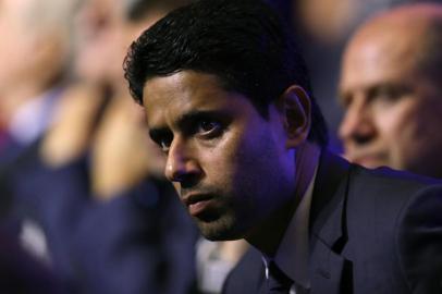 Paris Saint Germains (PSG) Qatari president Nasser Al-Khelaifi looks on during the UEFA Champions League football group stage draw ceremony in Monaco on August 24, 2017.  / AFP PHOTO / VALERY HACHE