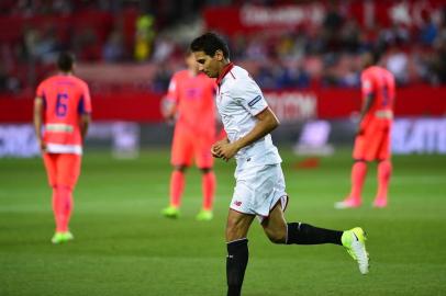 Sevillas Brazilian midfielder Ganso celebrates after scoring during the Spanish league football match Sevilla FC vs Granada FC at the Ramon Sanchez Pizjuan stadium in Sevilla on April 21, 2017. / AFP PHOTO / CRISTINA QUICLER