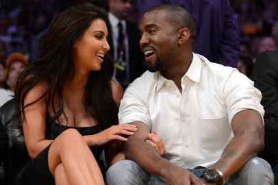 Denver Nuggets v Los Angeles Lakers - Game SevenLOS ANGELES, CA - MAY 12: Kim Kardashian and rapper Kanye West talk from their courtside seats as the Los Angeles Lakers take on the Denver Nuggets in Game Seven of the Western Conference Quarterfinals in the 2012 NBA Playoffs on May 12, 2012 at Staples Center in Los Angeles, California. NOTE TO USER: User expressly acknowledges and agrees that, by downloading and or using this photograph, User is consenting to the terms and conditions of the Getty Images License Agreement.   Harry How/Getty Images/AFPEditoria: SPOLocal: Los AngelesIndexador: Harry HowSecao: BasketballFonte: GETTY IMAGES NORTH AMERICAFotógrafo: STF